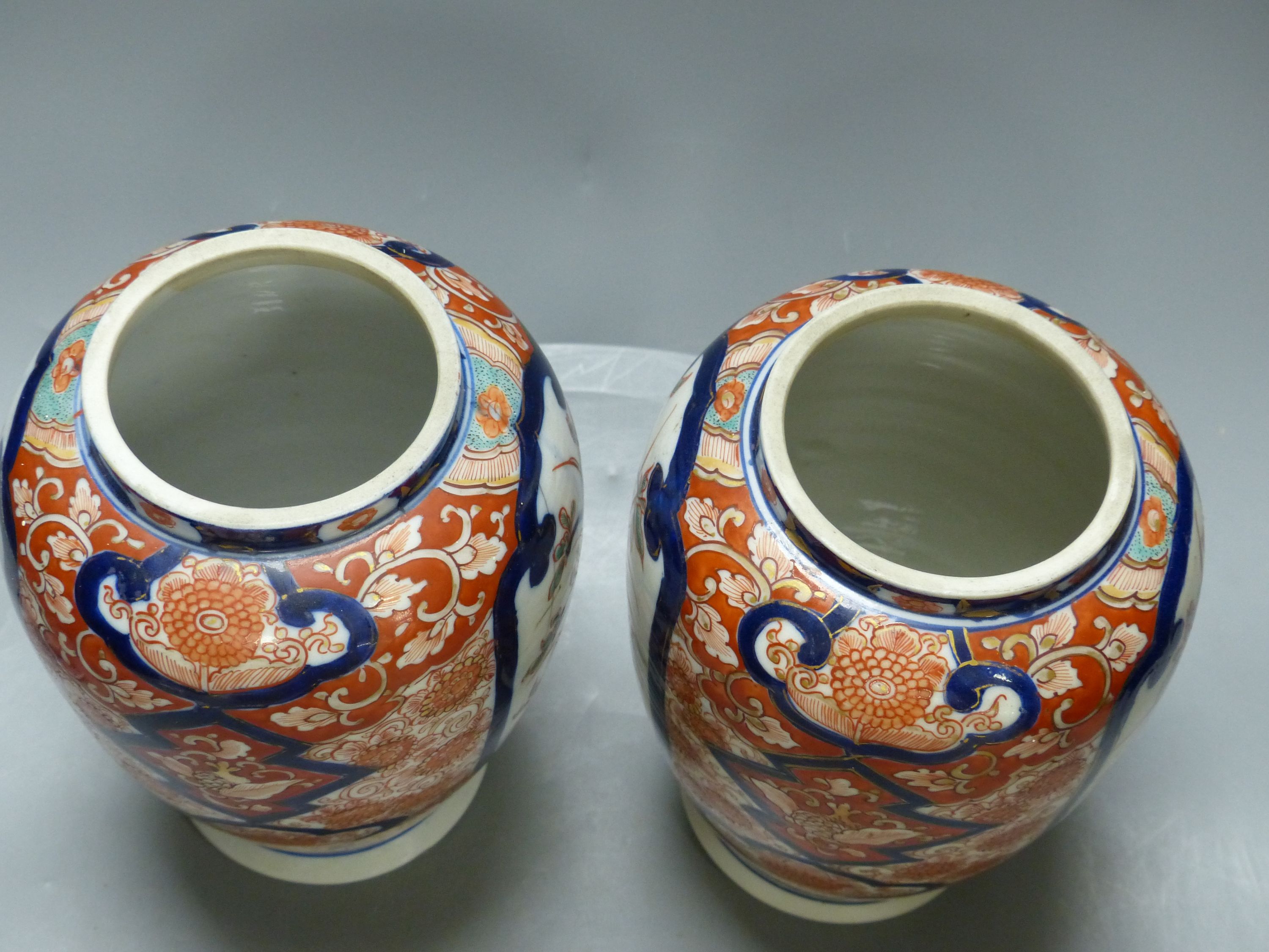 A pair of Imari vases and covers and a Limoges box, height 30cm